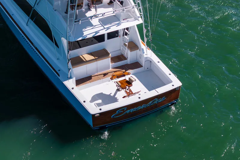 Emeritus Yacht Photos Pics Aerial view of 2001 Viking 61 Convertible yacht on green water.