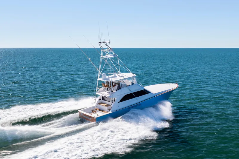 Emeritus Yacht Photos Pics 2001 Viking 61 Convertible yacht cruising on open sea, creating a dynamic wake.