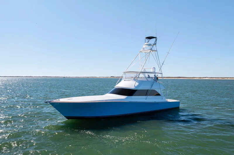 Emeritus Yacht Photos Pics 2001 Viking 61 Convertible yacht on open water under clear blue sky.