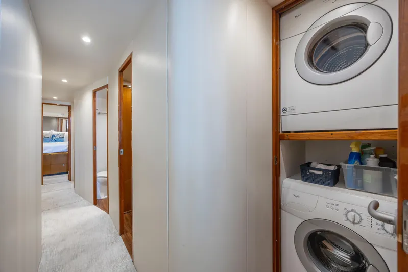 Emeritus Yacht Photos Pics Laundry area in 2001 Viking 61 Convertible yacht with stacked washer and dryer.
