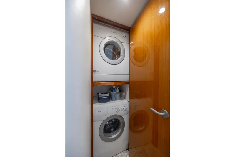 Emeritus Yacht Photos Pics Stacked washer and dryer in 2001 Viking 61 Convertible yacht laundry area.