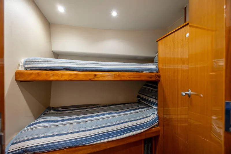Emeritus Yacht Photos Pics Bunk beds in 2001 Viking 61 Convertible yacht cabin with wooden cabinetry.
