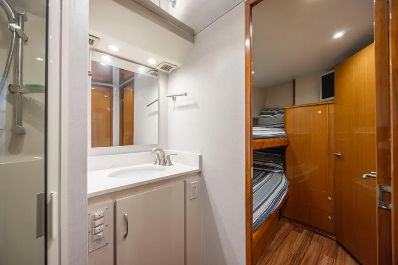 Emeritus Yacht Photos Pics Interior of 2001 Viking 61 Convertible yacht with bathroom and bunk beds.