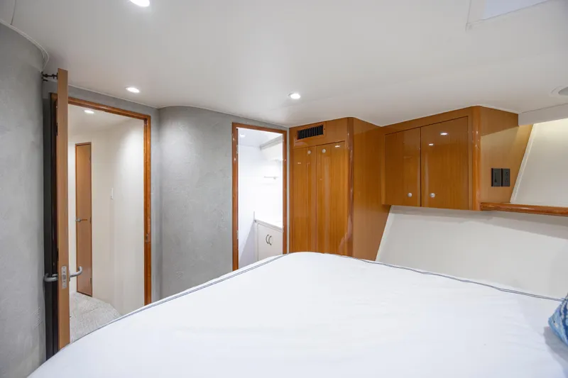 Emeritus Yacht Photos Pics Luxurious cabin interior of 2001 Viking 61 Convertible yacht with wooden cabinetry.