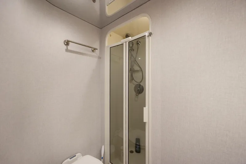 Emeritus Yacht Photos Pics Bathroom interior of 2001 Viking 61 Convertible yacht with shower and towel rack.