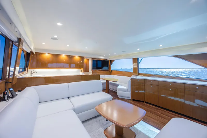 Emeritus Yacht Photos Pics Luxurious interior of 2001 Viking 61 Convertible yacht with modern furnishings and ocean view.