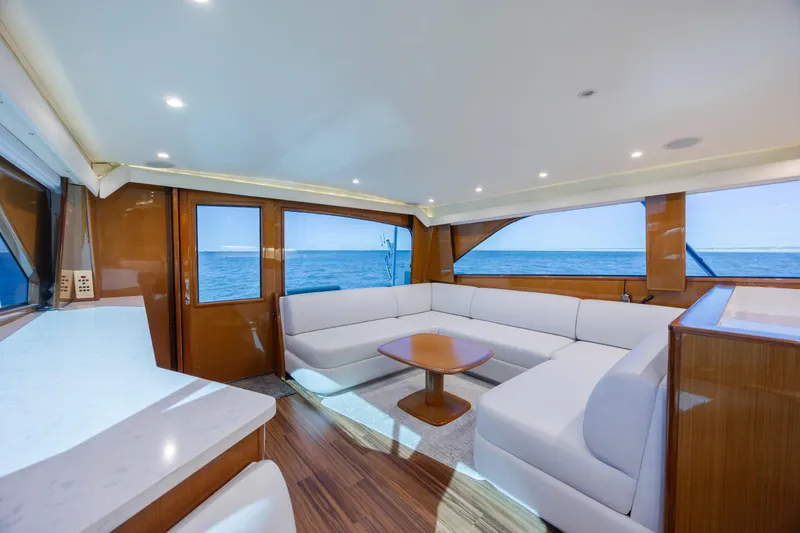 Emeritus Yacht Photos Pics Luxurious interior of 2001 Viking 61 Convertible yacht with ocean view.