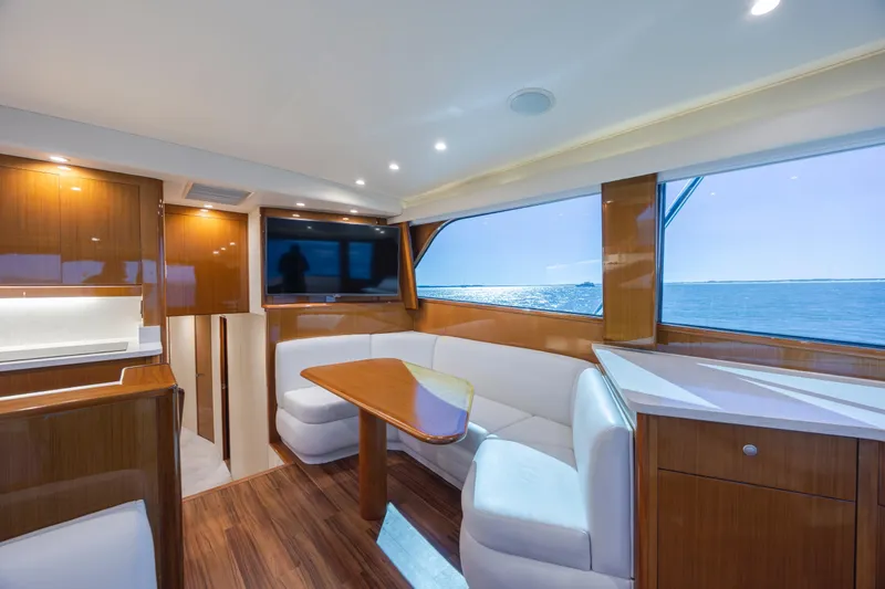 Emeritus Yacht Photos Pics Luxurious interior of 2001 Viking 61 Convertible yacht with ocean view.