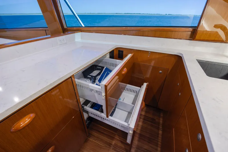 Emeritus Yacht Photos Pics Luxurious kitchen interior of 2001 Viking 61 Convertible yacht with ocean view.