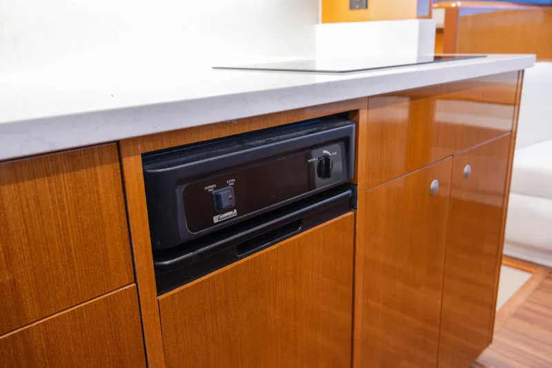 Emeritus Yacht Photos Pics Wooden cabinetry in 2001 Viking 61 Convertible yacht kitchen with built-in Kenmore appliance.