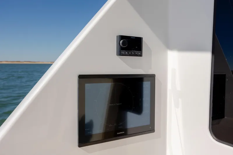 Emeritus Yacht Photos Pics Control panel on a 2001 Viking 61 Convertible yacht, featuring Garmin navigation.