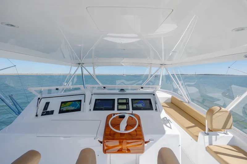 Emeritus Yacht Photos Pics 2001 Viking 61 Convertible yacht helm with navigation screens and ocean view.