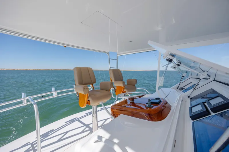 Emeritus Yacht Photos Pics 2001 Viking 61 Convertible yacht helm with ocean view and modern controls.
