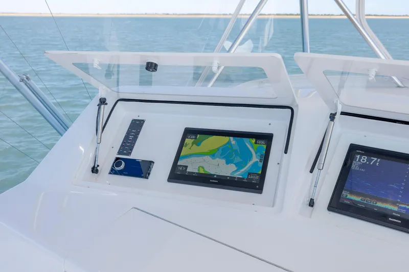 Emeritus Yacht Photos Pics Control panel of a 2001 Viking 61 Convertible yacht with navigation screens.