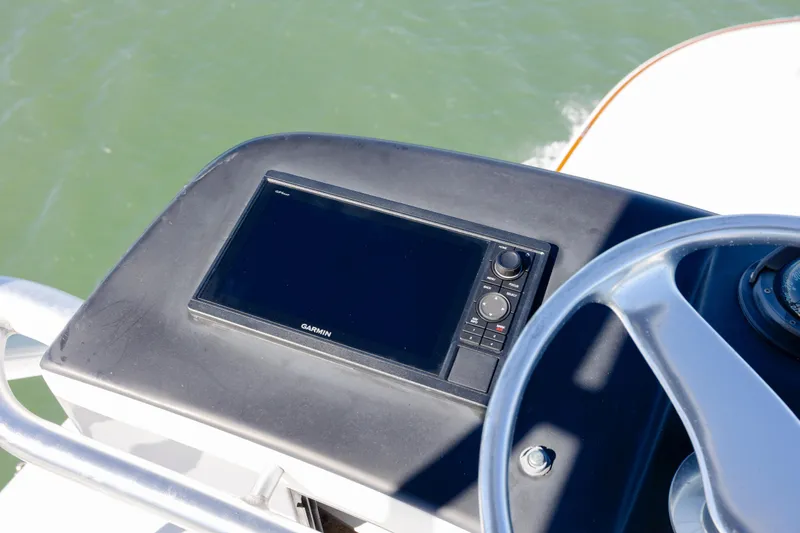 Emeritus Yacht Photos Pics Steering console of 2001 Viking 61 Convertible with Garmin navigation system.