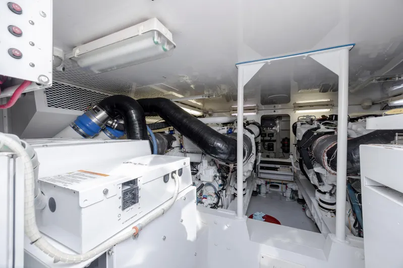 Emeritus Yacht Photos Pics Engine room of 2001 Viking 61 Convertible yacht, showcasing mechanical components and systems.