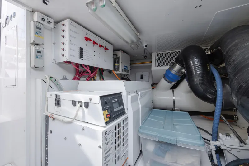 Emeritus Yacht Photos Pics Engine room of 2001 Viking 61 Convertible yacht with control panels and equipment.