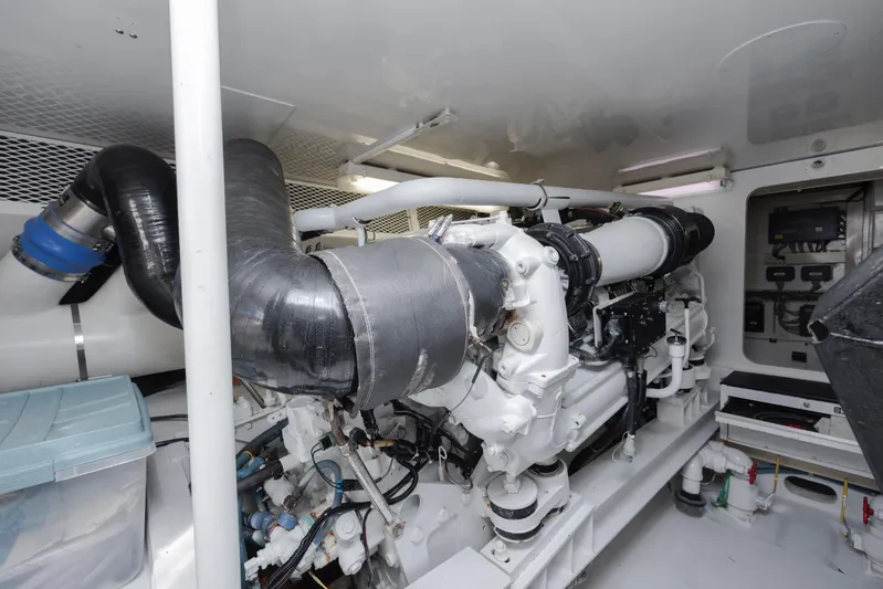 Emeritus Yacht Photos Pics Engine room of a 2001 Viking 61 Convertible yacht, showcasing machinery and components.