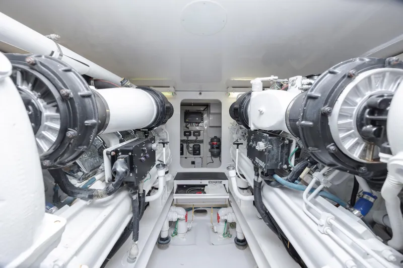 Emeritus Yacht Photos Pics Engine room of 2001 Viking 61 Convertible yacht, showcasing mechanical components and systems.