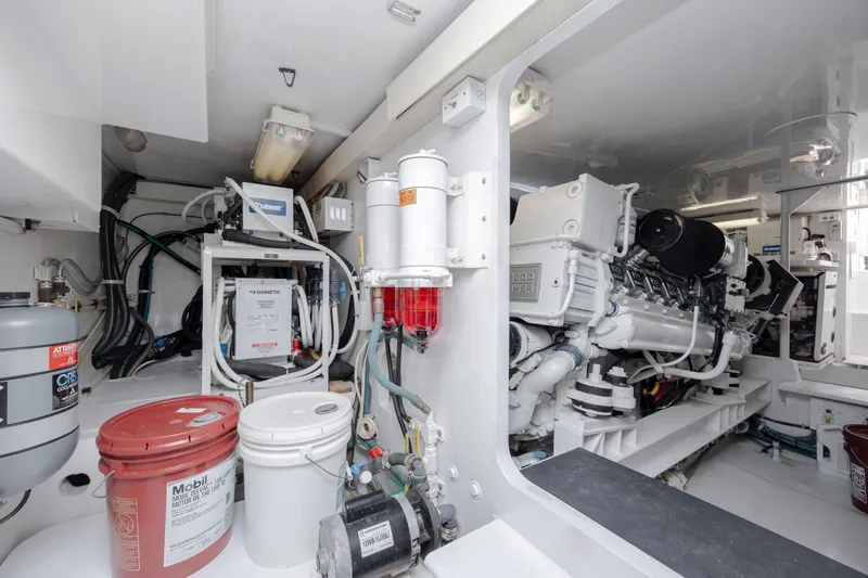 Emeritus Yacht Photos Pics Engine room of 2001 Viking 61 Convertible yacht, showcasing machinery and equipment.