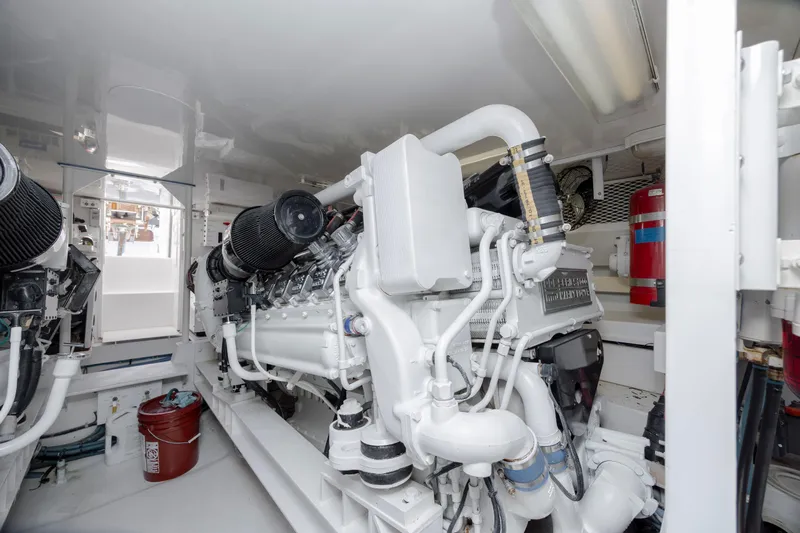 Emeritus Yacht Photos Pics Engine room of 2001 Viking 61 Convertible yacht, showcasing clean, organized machinery.