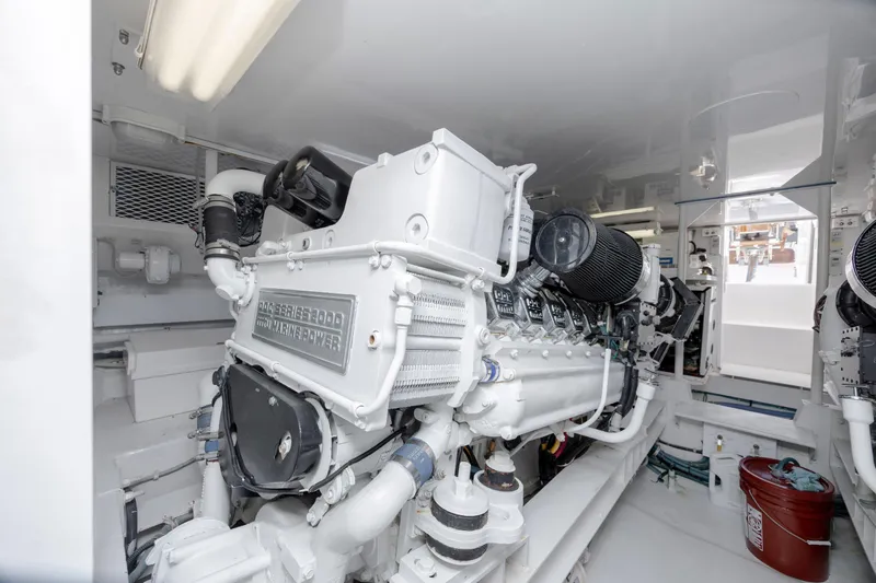 Emeritus Yacht Photos Pics Engine room of a 2001 Viking 61 Convertible yacht, showcasing powerful marine engine.