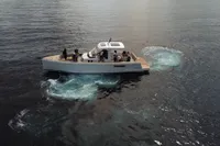 2023 Fjord 38 Open yacht cruising on calm ocean waters.
