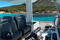 2023 Fjord 38 Open boat interior with scenic coastal view.