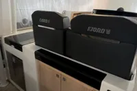 2023 Fjord 38 Open interior with modern helm and sleek cabinetry design.