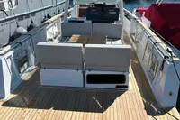 2023 Fjord 38 Open yacht with spacious deck, docked in a marina.