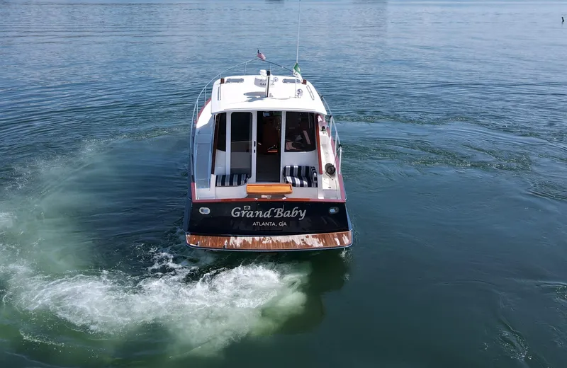 Grand Baby Yacht Photos Pics Legacy 42 boat named "Grand Baby" cruising on calm water, 2018 model.