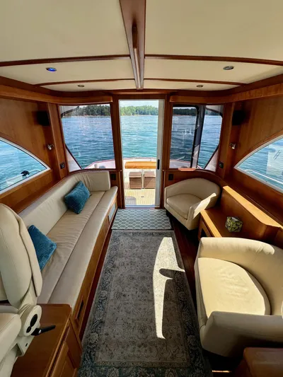 Grand Baby Yacht Photos Pics Luxurious interior of 2018 Legacy 42 yacht with elegant seating and scenic water views.