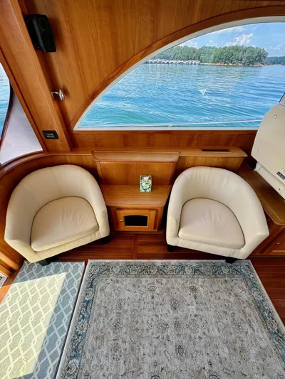 Grand Baby Yacht Photos Pics Luxurious Legacy 42 yacht interior with plush seating and scenic water view, 2018 model.