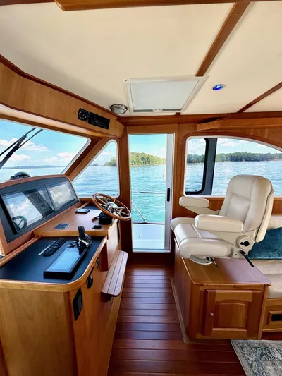 Grand Baby Yacht Photos Pics Interior of 2018 Legacy 42 boat with wooden finish and scenic water view.