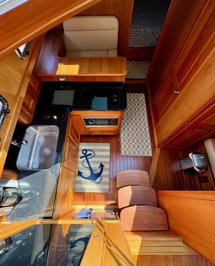 Grand Baby Yacht Photos Pics Interior of 2018 Legacy 42 yacht with wood finish and nautical decor.