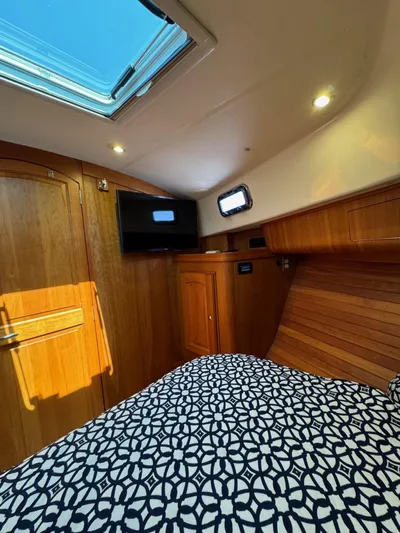 Grand Baby Yacht Photos Pics Luxurious cabin interior of 2018 Legacy 42 yacht with skylight and modern amenities.