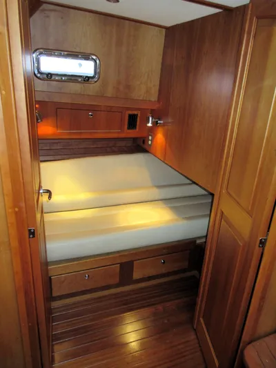 Grand Baby Yacht Photos Pics Cozy cabin interior of 2018 Legacy 42 yacht with wooden finish and built-in storage.