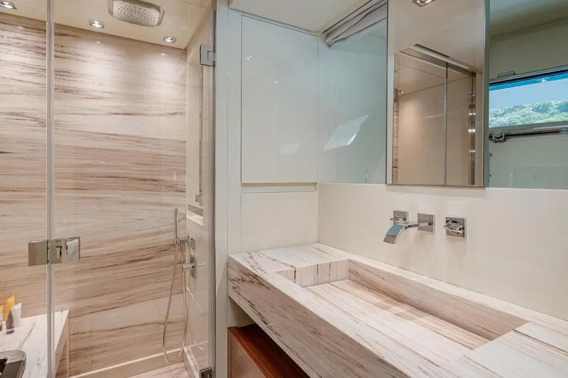 4leon Yacht Photos Pics Luxurious bathroom in 2026 Navetta Navetta 33 yacht with modern fixtures and elegant design.