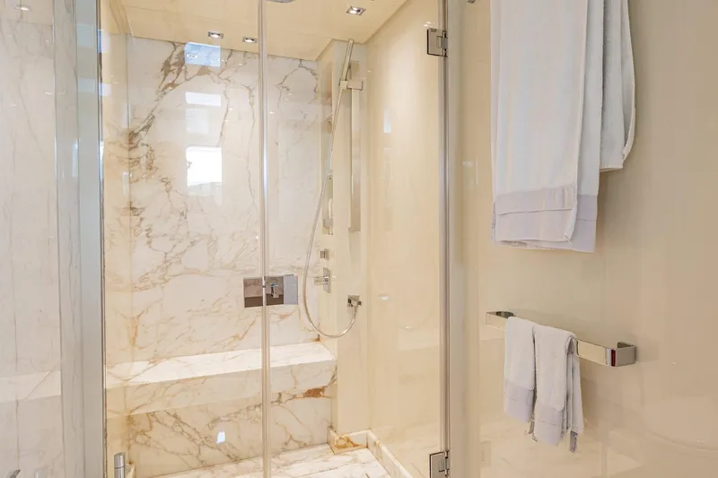 4leon Yacht Photos Pics Luxurious marble shower in 2026 Navetta Navetta 33 yacht bathroom.