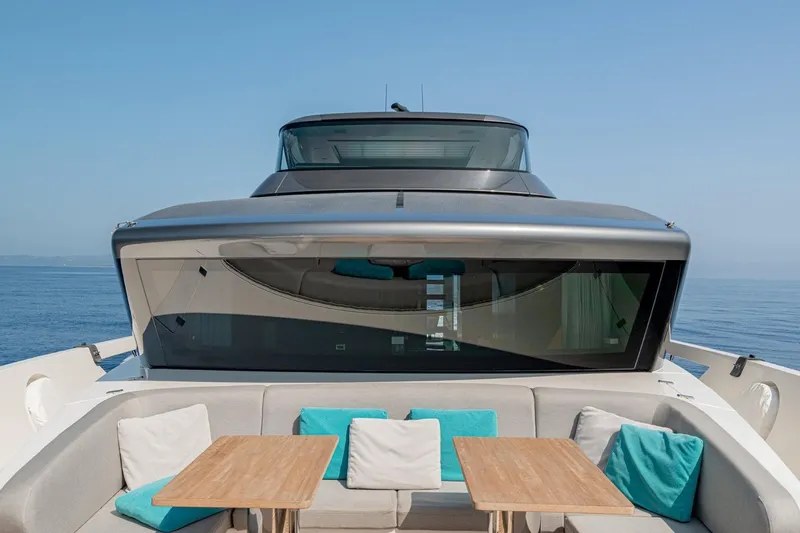 4leon Yacht Photos Pics Luxurious 2026 Navetta 33 yacht with elegant seating and ocean view.