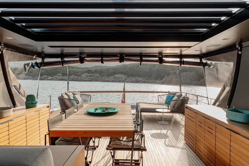4leon Yacht Photos Pics Luxurious Navetta 33 yacht interior with elegant dining area, ocean view, and modern furnishings, 2026 model.