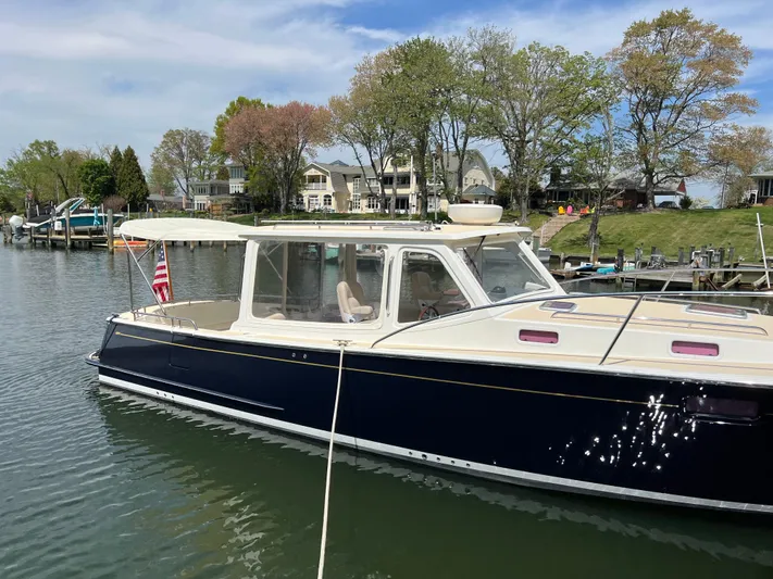 True Grace Yacht Photos Pics 2011 MJM 36Z boat docked in a scenic waterfront setting.