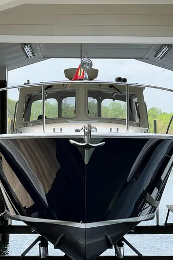 True Grace Yacht Photos Pics 2011 MJM 36Z boat docked in a covered marina, front view.