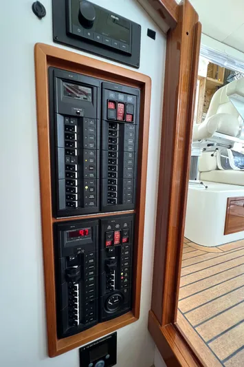 True Grace Yacht Photos Pics Control panel on a 2011 MJM 36Z boat, featuring switches and circuit breakers.