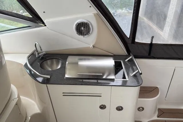 Pura Vida Yacht Photos Pics 2012 Sea Ray 370 Sundancer boat kitchenette with sink and grill.