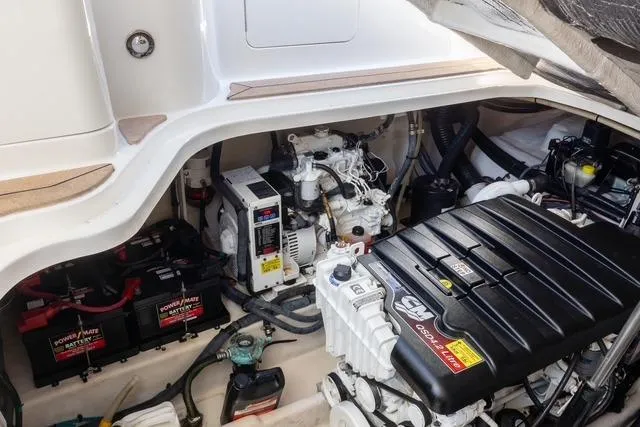 Pura Vida Yacht Photos Pics Engine compartment of a 2012 Sea Ray 370 Sundancer with visible components and batteries.