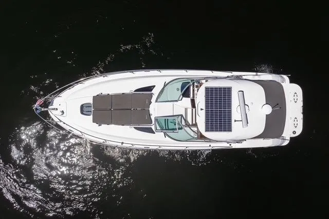 Pura Vida Yacht Photos Pics Overhead view of 2012 Sea Ray 370 Sundancer yacht on dark water.