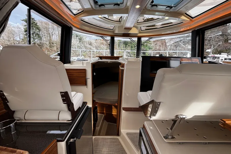  Yacht Photos Pics Interior of 2026 Ranger Tugs R-29 CB, featuring luxurious seating and panoramic windows.