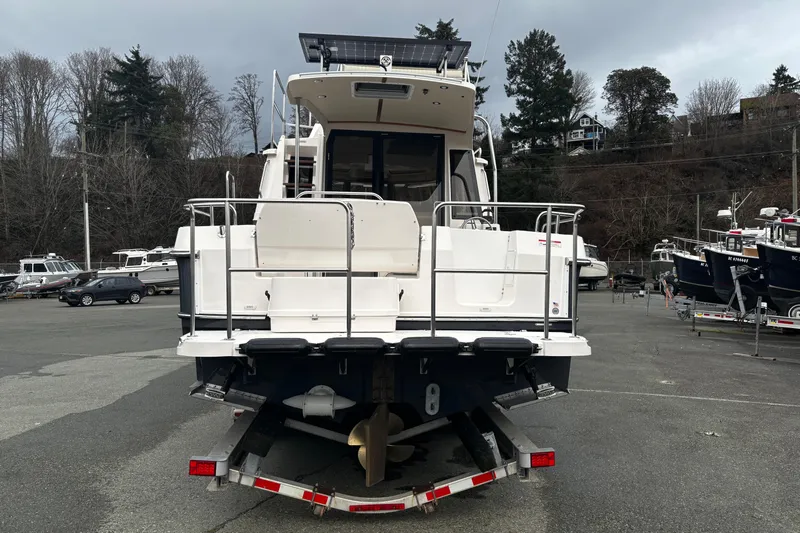  Yacht Photos Pics 2026 Ranger Tugs R-29 CB boat on trailer, parked in a marina lot.