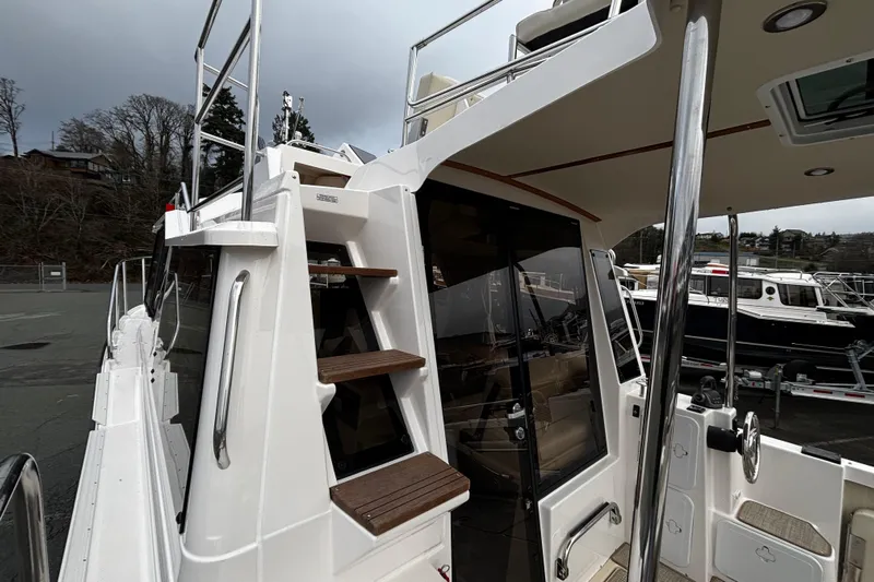  Yacht Photos Pics 2026 Ranger Tugs R-29 CB boat with exterior stairs and sleek design.